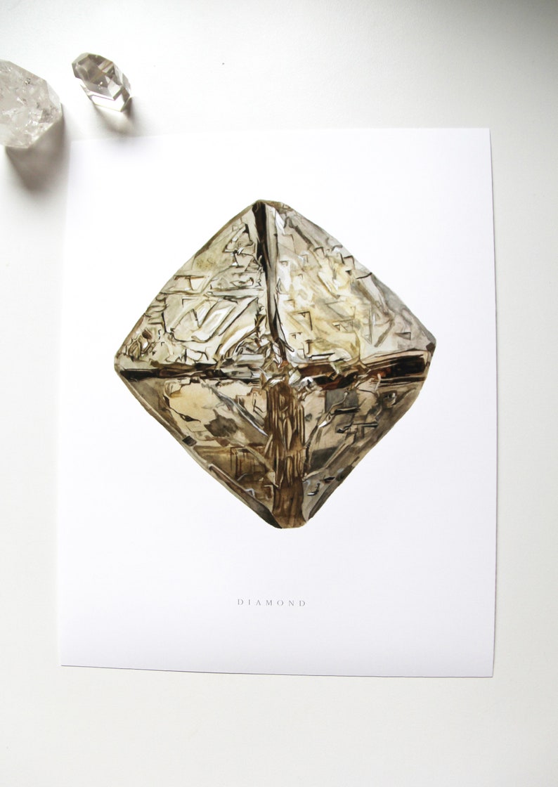 May include: A watercolor illustration of a diamond crystal on a white background. The diamond is a light brown color and has a geometric shape. The text "DIAMOND" is printed below the diamond.