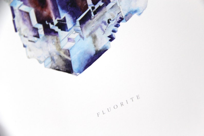 May include: A watercolor painting of a blue and purple fluorite crystal. The crystal is depicted in a geometric shape with sharp edges and a textured surface. The painting is titled "Fluorite" in a simple, elegant font.