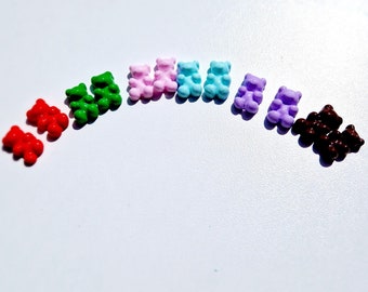 May include: A rainbow assortment of gummy bear charms in various colors, including red, green, pink, blue, purple, and brown.