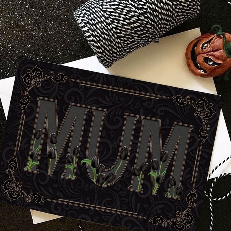May include: Black and gold card with the word "MUM" in large, bold letters. The letters are filled with black tulips and have a 3D effect. The background is a black and gold floral pattern.
