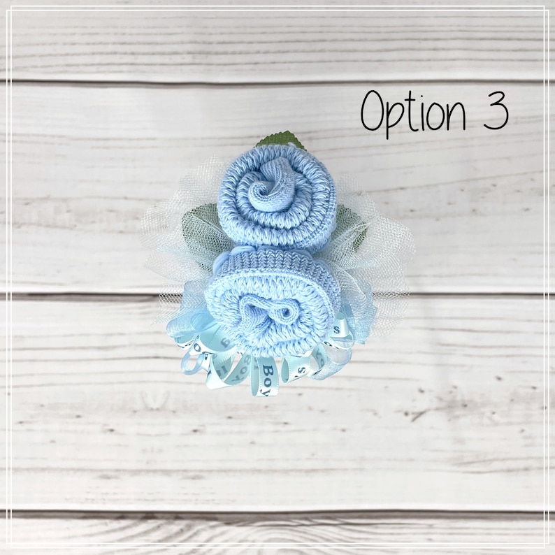 May include: A blue baby sock flower bouquet with a blue ribbon that says "It's a Boy!" Option 3.