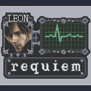 May include: Cross-stitch design featuring a portrait of a man with the name "LEON" above. A green heartbeat monitor is on the right, and the word "requiem" is below. The design is framed.