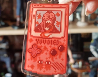 Chaveiro Resident Evil, Chaveiro Game Boy, Chaveiro de Terror, Chaveiro de Jogo, Chaveiro Gamer, Leon Kennedy, Acrílico, Presente para Gamer, Enfeite para Bolsa