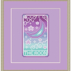 May include: Framed cross-stitch artwork with a celestial theme. It depicts a crescent moon, stars, and clouds in purple, teal, and white. The text "THE MOON" is at the bottom. The artwork is framed in a gold and purple frame, suitable for home decor.