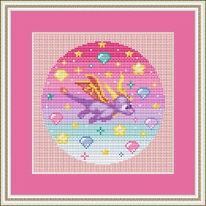 May include: Cross-stitch art of a purple dragon with yellow wings, surrounded by stars, gems, and hearts. The design is set against a gradient pink and blue background, framed in pink and a gold-colored border.
