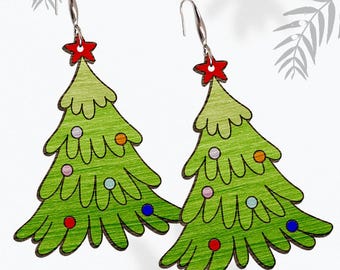 May include: A pair of green Christmas tree earrings with red, orange, blue, and pink ornaments. The earrings are made of wood and have silver hooks.