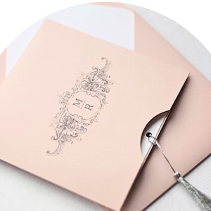 Dusty pink wedding invitation with tassel