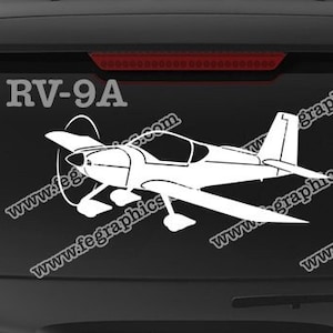 May include: A white RV-9A airplane decal with the text "www.fegraphics.com Flight Engineered Graphics" and "Veteran Owned Business" below. The decal is on the back window of a black SUV.