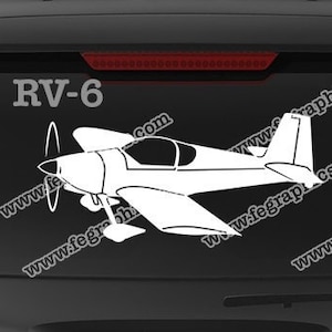 May include: A white RV-6 airplane decal with the text "www.fegraphics.com Flight Engineered Graphics" and "Veteran Owned Business" on a black car window.