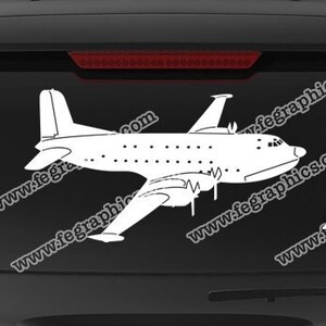 May include: A white decal of a C-47 airplane on a black car. The decal is available for purchase from the website www.fegraphics.com. The website also features the text "Flight Engineered Graphics" and "Veteran Owned Business".