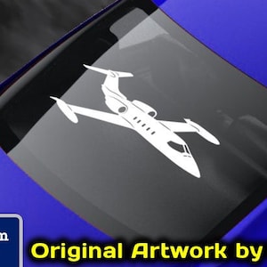 May include: A white decal of a small private jet on a blue car. The decal is for sale on the website www.fegraphics.com. The website is for Flight Engineered Graphics, a veteran owned business that makes aircraft decals.