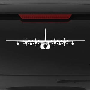 May include: White vinyl decal of a C-130 Hercules aircraft on a black vehicle. The decal is a silhouette of the plane, with the text "Veteran Owned Business" and the website address "fegraphics.com" visible.