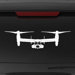 May include: A black SUV with a white silhouette of a V-22 Osprey aircraft on the back window. The vehicle has a "Veteran Owned Business" sticker on the rear bumper.