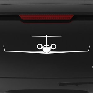 May include: A black SUV with a white silhouette of a private jet on the back window. The vehicle has a "Veteran Owned Business" sticker on the back bumper.