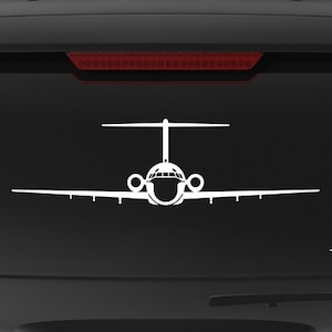 May include: A black SUV with a white silhouette of a plane on the back window. The car has a "Veteran Owned Business" sticker on the back bumper.