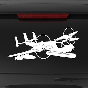 May include: A black SUV with a white decal of a plane on the back window. The decal says "Veteran Owned Business" with an American flag.