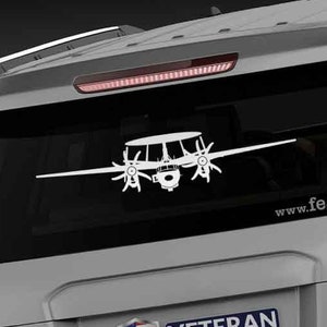 May include: A gray SUV with a white silhouette of a plane on the back window. The car has a "Veteran Owned Business" sticker with an American flag on the back. The text "www.fegraphics.com" is printed on the back of the car.