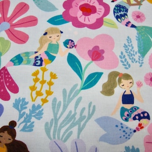 May include: A light blue fabric with a repeating pattern of mermaids, flowers, and seaweed. The mermaids are wearing colorful tails and have long flowing hair. The flowers are pink, blue, and yellow. The seaweed is green and blue.