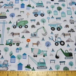 May include: White fabric with a repeating pattern of construction vehicles and equipment. The pattern includes dump trucks, cement mixers, excavators, cranes, and road signs. The vehicles are in shades of blue, green, and yellow.
