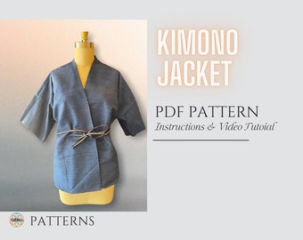 May include: A blue kimono jacket sewing pattern with instructions and a video tutorial. The pattern is for a short-sleeved jacket with a tie belt.