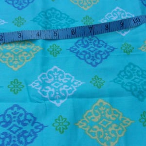 Turquoise or Aqua with Blue, Yellow, Teal and White Medallions from Fabric Traditions