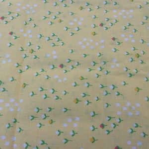 Yellow Fabric with Tiny White and Pink Flowers