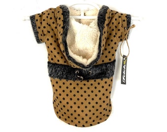 May include: A brown hooded dog sweater with black polka dots and a faux fur trim. The sweater has a black drawstring and a tag that says "Fetch!"