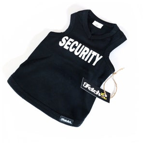 May include: Black sleeveless dog shirt with the word "SECURITY" printed in white on the front. The shirt has a V-neck and is made of a soft, comfortable material. The shirt is tagged with a "Fetch" brand label.