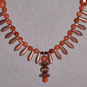 Stunning Goldstone necklace set with Copper and black Czech Glass teardrops with a Copper and Goldstone pendant with matching earrings