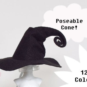 May include: A black witch hat with a wide brim and a curled, poseable cone. The text "Poseable Cone!" and "12+ Colors" are displayed in white. The hat is displayed on a mannequin head.