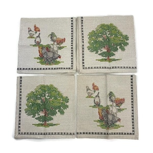 May include: Set of four white cotton napkins with a black border. Each napkin features a green mosaic tree and a group of chickens with red, orange, and black details.