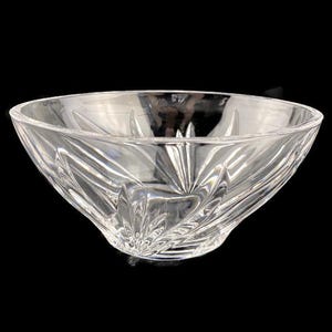 May include: A clear glass bowl with a decorative, cut-glass design. The bowl is round and has a wide, shallow shape.