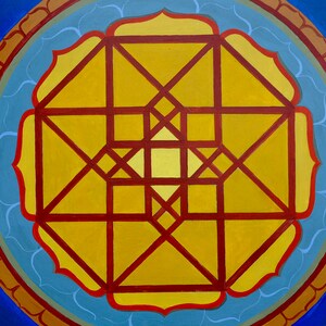 May include: A circular mandala design with a yellow centre and red lines forming a geometric pattern. The mandala is surrounded by a blue and brown border.