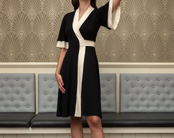 Gabija black and ivory color block wrap dress