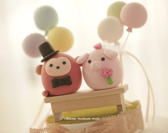 pig and monkey wedding cake topper