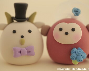 Goat and Monkey wedding cake topper