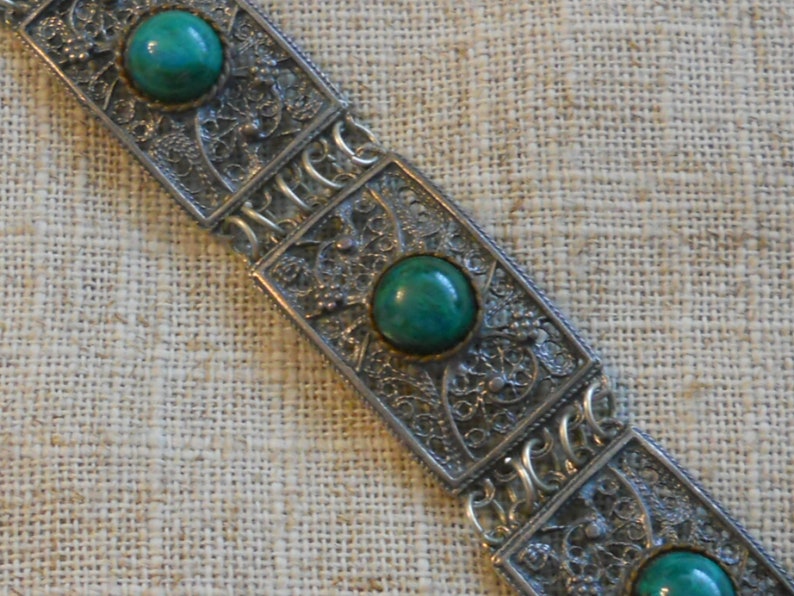 Vintage filigree bracelet with green stones
