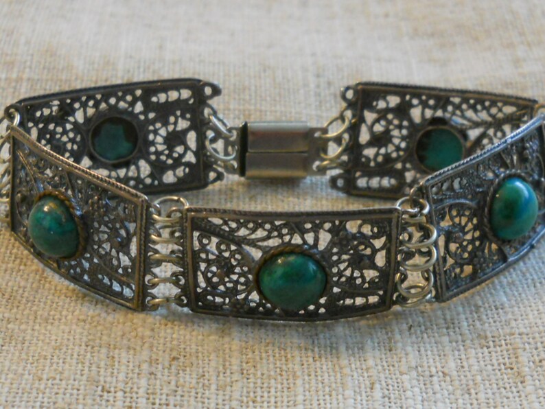 Vintage filigree bracelet with green stones