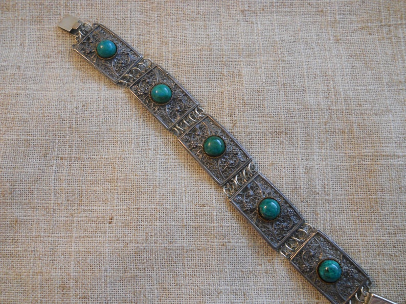 Vintage filigree bracelet with green stones