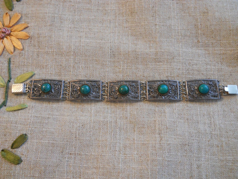 Vintage filigree bracelet with green stones