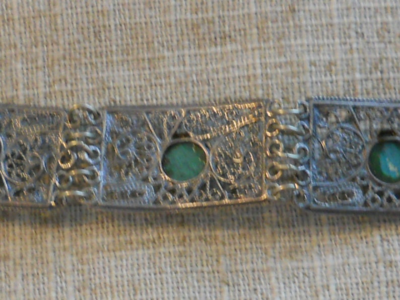 Vintage filigree bracelet with green stones
