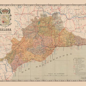May include: A vintage-style map of the Malaga province in Spain, featuring a beige background, topographical shading in earth tones, and a detailed coat of arms in the upper left corner. The map includes a legend, grid lines, and text labels.