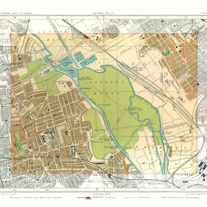 May include: A vintage map titled Handy-Volume Atlas of London, Plate 31, featuring Hackney Marsh in green, residential areas in tan, and railway lines in black. The map includes grid lines, street names, and a legend indicating railways and tramways.