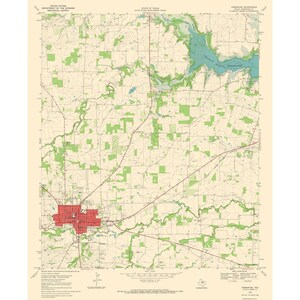 May include: A vintage United States Geological Survey topographic map of Comanche, Texas, featuring a cream background, green forested areas, blue water bodies, and a red shaded urban zone, with detailed contour lines and geographic labels.