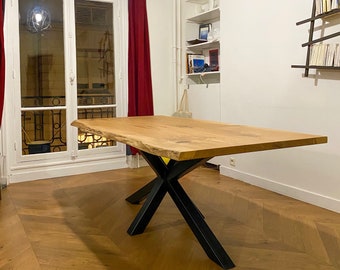 Live edge wooden table on central X frame