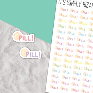 May include: A sheet of colorful stickers with the word "PILL!" printed on each sticker. The stickers are in various pastel colors, including pink, blue, yellow, and green. The stickers are arranged in rows and columns on a white background.