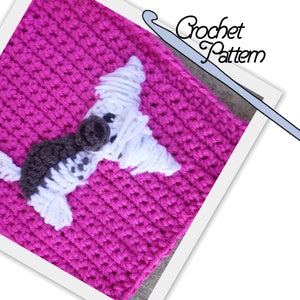 May include: A crochet square with a white and brown dog applique on a pink background. The text "Crochet Pattern" is visible in the top right corner of the image.
