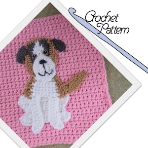 May include: A crochet pattern for a pink blanket with a brown and white dog applique. The dog is sitting with its legs crossed and has a brown nose and black eyes. The pattern is written in English and includes instructions for crocheting the dog applique.