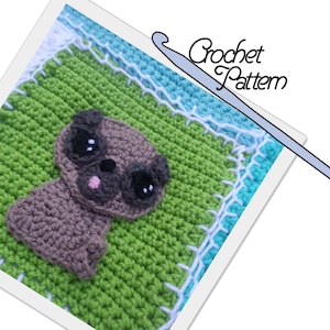 May include: Crochet pattern for a cute pug amigurumi. The pug is brown with black eyes and a pink tongue. The pattern is displayed on a green and blue crocheted blanket with white trim.