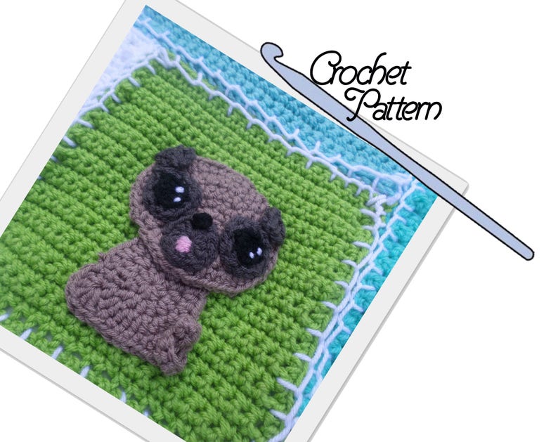 May include: Crochet pattern for a cute pug amigurumi. The pug is brown with black eyes and a pink tongue. The pattern is displayed on a green and blue crocheted blanket with white trim.